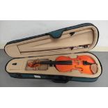 Modern 1/2 size violin by Stentor. Spruce top and two piece maple back. Complete with case and bow.