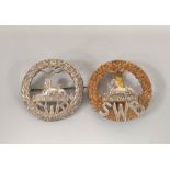 British Militaria. Two early 20th Century South Wales Borderers (S.W.B) badges to include a bi-