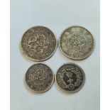 Japan. Silver coins to include an 1870 Twenty Sen, another dated 1875 and two Ten Sen coins (4)
