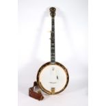 Gibson Mastertone four string banjo with satin wood design in fitted case, 95cm long.