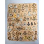 British Militaria Interest. Tray containing a large quantity of cap badges with regiments to include