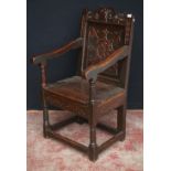 Oak Wainscot chair, c. late 17th/early 18th century, decorated with fleur de lys motifs and a floral