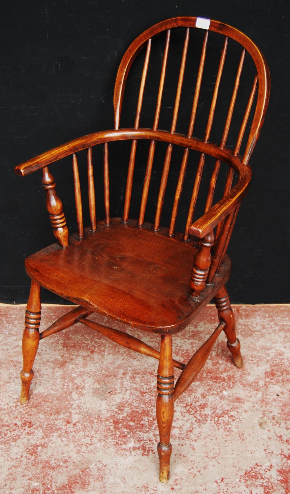 Antique ash and elm Windsor armchair with hoop frame, stick back and solid seat, on turned