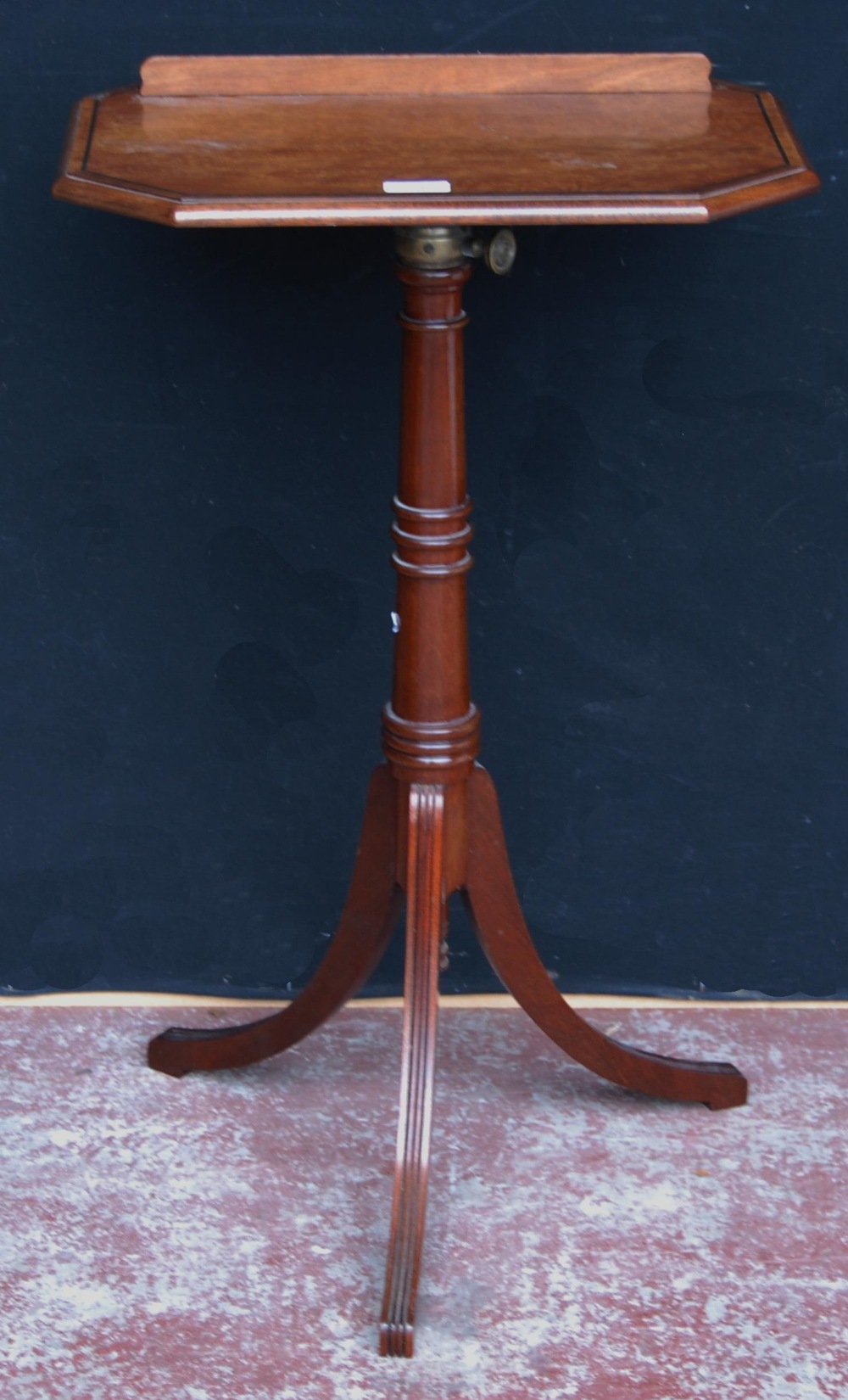 Walnut telescopic reading table, c. late 19th/early 20th century, the octagonal burr top with ledge,