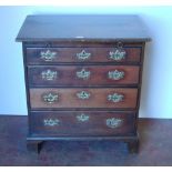 George III mahogany bachelor's chest of four graduated drawers with brushing slide, on bracket feet,