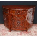 Mahogany commode of demi-lune shape in the 18th century style, with a drawer above a cupboard door