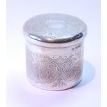 Silver cylindrical box with engraved scrolls and engine turning, by Goldsmiths & Silversmiths Co.,