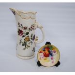 Royal Worcester jug of tusk form decorated with flowers and curling stems on ivory coloured