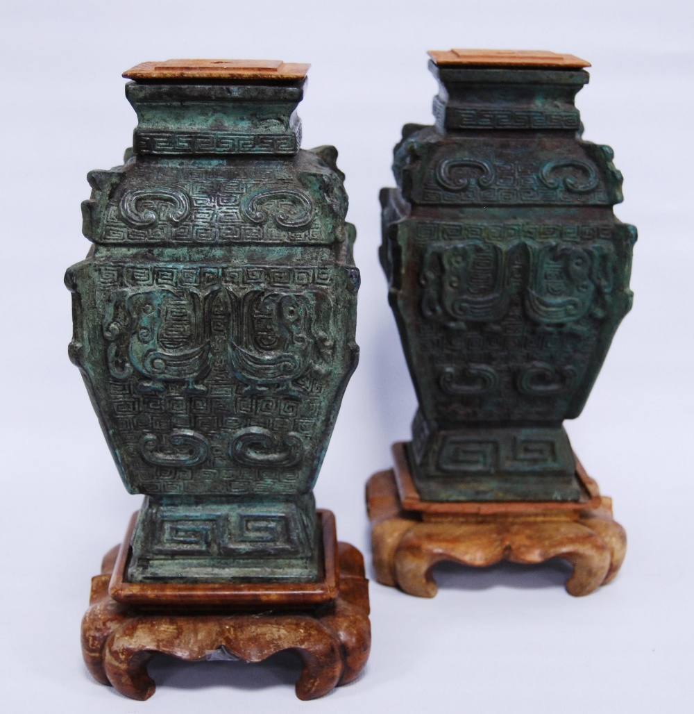 Pair of oriental verdigris (green) cast vases (mid to last quarter of the 20th century) of archaic