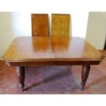 Late Victorian oak extending dining table with two additional leaves, on reeded baluster legs and