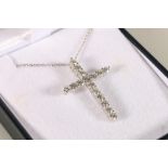 18ct white gold cross set with round brilliant-cut diamonds on an 18ct white gold chain, diamond