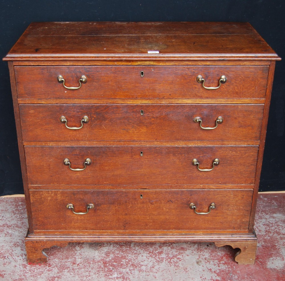 George III oak chest of four graduated long drawers, on bracket feet, 93cm high, 97.5cm wide and