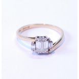 Diamond three-stone baguette ring, the largest approximately 10mm x 5mm, flanked by two others, in