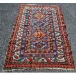 Antique Turkish hand-knotted rug with four geometric medallions to the centre within all over