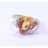 Citrine ring with angled pear-shaped citrine and four diamonds, in 18ct gold, 1992.