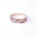 Gold half hoop-style ring with zigzag of diamond brilliants, in 18ct gold, size K.