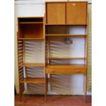 Teak Ladderax unit, c. 1960s, with sliding doors to the top above open shelving and a drawer,