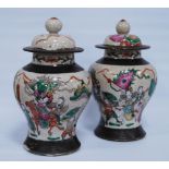 Pair of Chinese crackle glazed baluster vases and covers (20th century) decorated with battle scenes