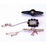 Gold brooch with pearl-set dove, a late Georgian brooch with black tourmaline and another.  (3)