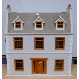 Painted wood doll's house of large size with door opening to reveal six rooms with furnishings, 81cm