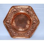Arts & Crafts copper octagonal wall charger, impressed to the border with stylised hearts and