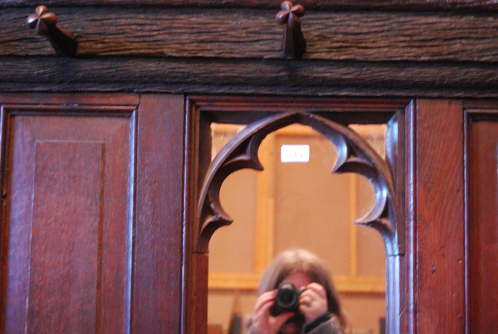 English Arts & Crafts  Oak hallstand with naturalistic cornice and five ornate pegs above a Gothic- - Image 2 of 5
