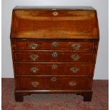 18th century walnut inlaid writing bureau, the fall front enclosing fitted drawers and pigeon