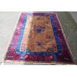 Chinese rug, c. early 20th century, with all over floral panels on beige ground with a blue, wine