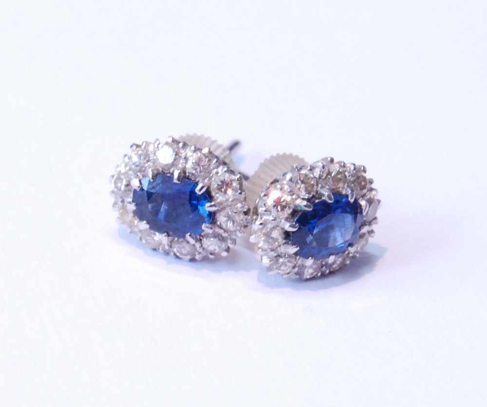 Pair of sapphire and diamond cluster earrings, unmarked, probably white gold, with central oval- - Image 4 of 5
