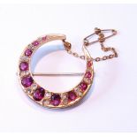 Victorian gold crescent brooch with pink tourmalines and diamond points, 7.4g gross.
