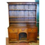 George III style oak Welsh dresser, c. 19th century, the top section with open Delft racks and