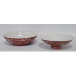 Two near-matching Chinese famille rose porcelain bowls, decorated all over with ruyi, floral