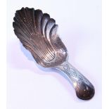 Silver scallop caddy spoon with engraved grip, by Taylor and Perry, Birmingham 1829.