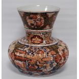 Oriental Imari vase of bulbous form decorated all over with floral panels and blossoming trees in