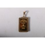 Johnson Matthey of London 999 grade fine gold ingot in gold pendant mount, the ingot inset with