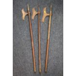 Three Indian Chota Nagpur type tabar pole axes, the longest 101cm long. (3)