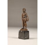 EB Morty (German 20th century) bronze figure of a smoking boy with basket, height 16cm