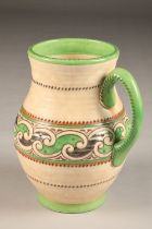 Charlotte Rhead Crown Ducal vase, with single handle with green and orange decoration, height 26cm