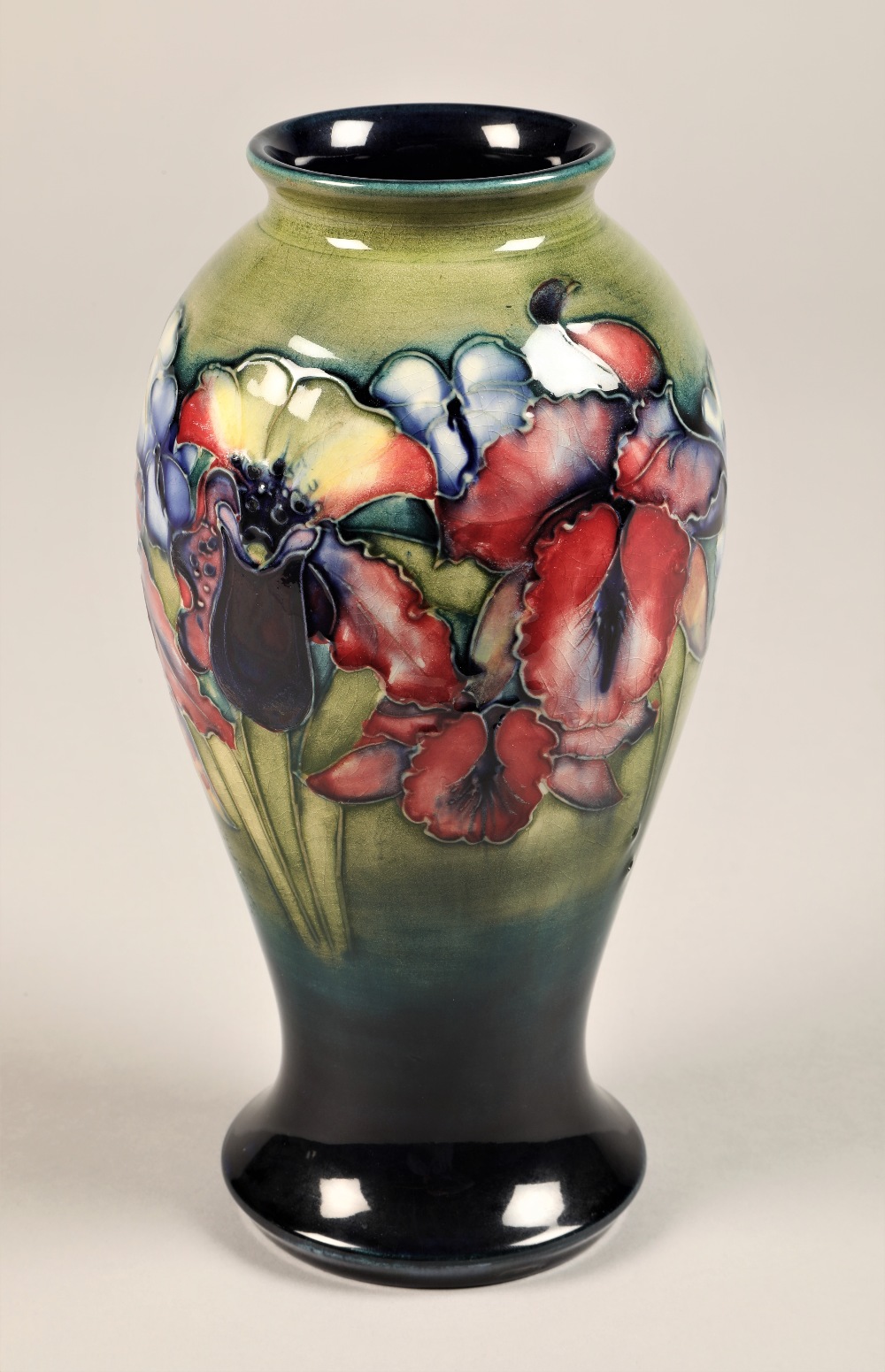 Moorcroft pottery vase, baluster form, decorated with orchid pattern, signed and incised