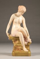 Art Nouveau Bohemia Royal Dux porcelain figure, of a seated maiden with a pink robe, applied red