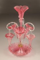 Large Victorian cranberry glass epergne, central trumpet with three smaller glass trumpets with