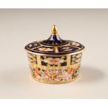Royal Crown Derby bone china trinket dish and cover, decorated with Imari pattern, diameter 7.5cm,