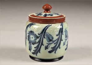 McIntyre Tobacco jar and cover, brown bands with blue stylised flower decoration, brown factory