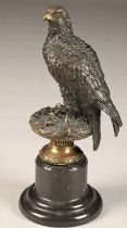 After Archibald Thorburn (Scottish 1860-1935) Bronze figure of a perched golden eagle, on a marble