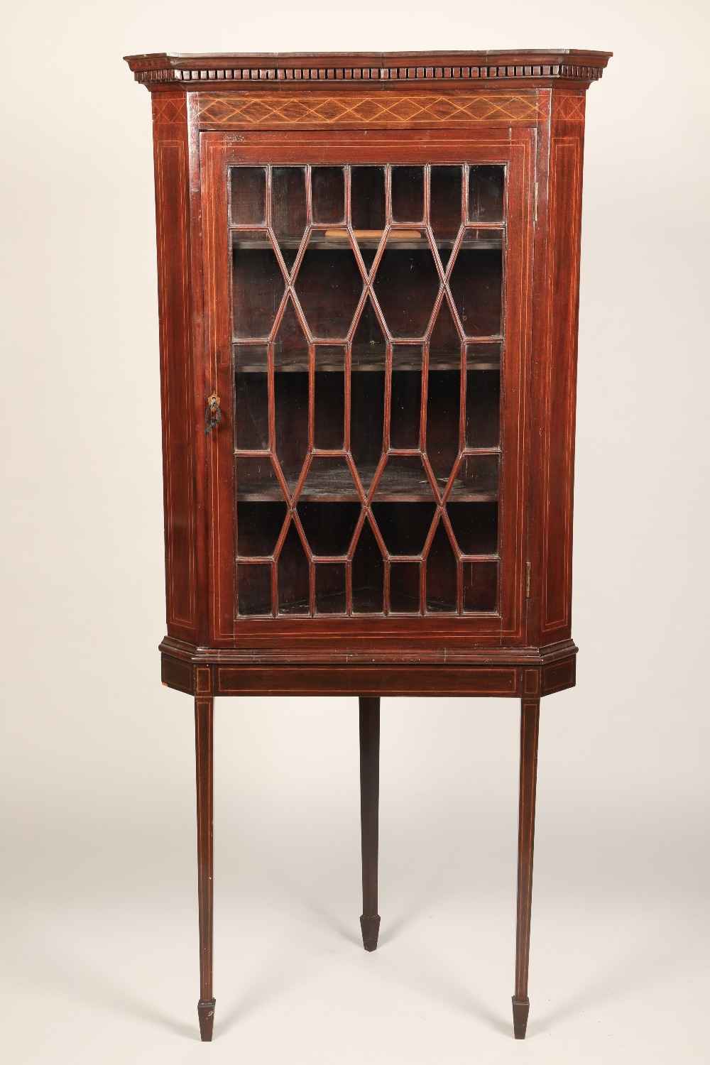 Edwardian inlaid mahogany glazed corner cabinet on stand, height 181cm