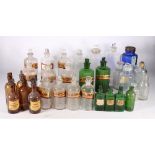Collection of thirty three glass apothecary bottles,