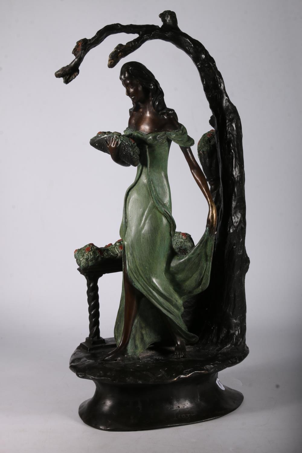 Signed patinated bronze figure modelled as a painted clad female holding a basket of flowers, beside