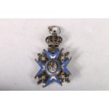 Russian enamel and white metal medal with Maltese cross with saint and dated 1883, 6cm.