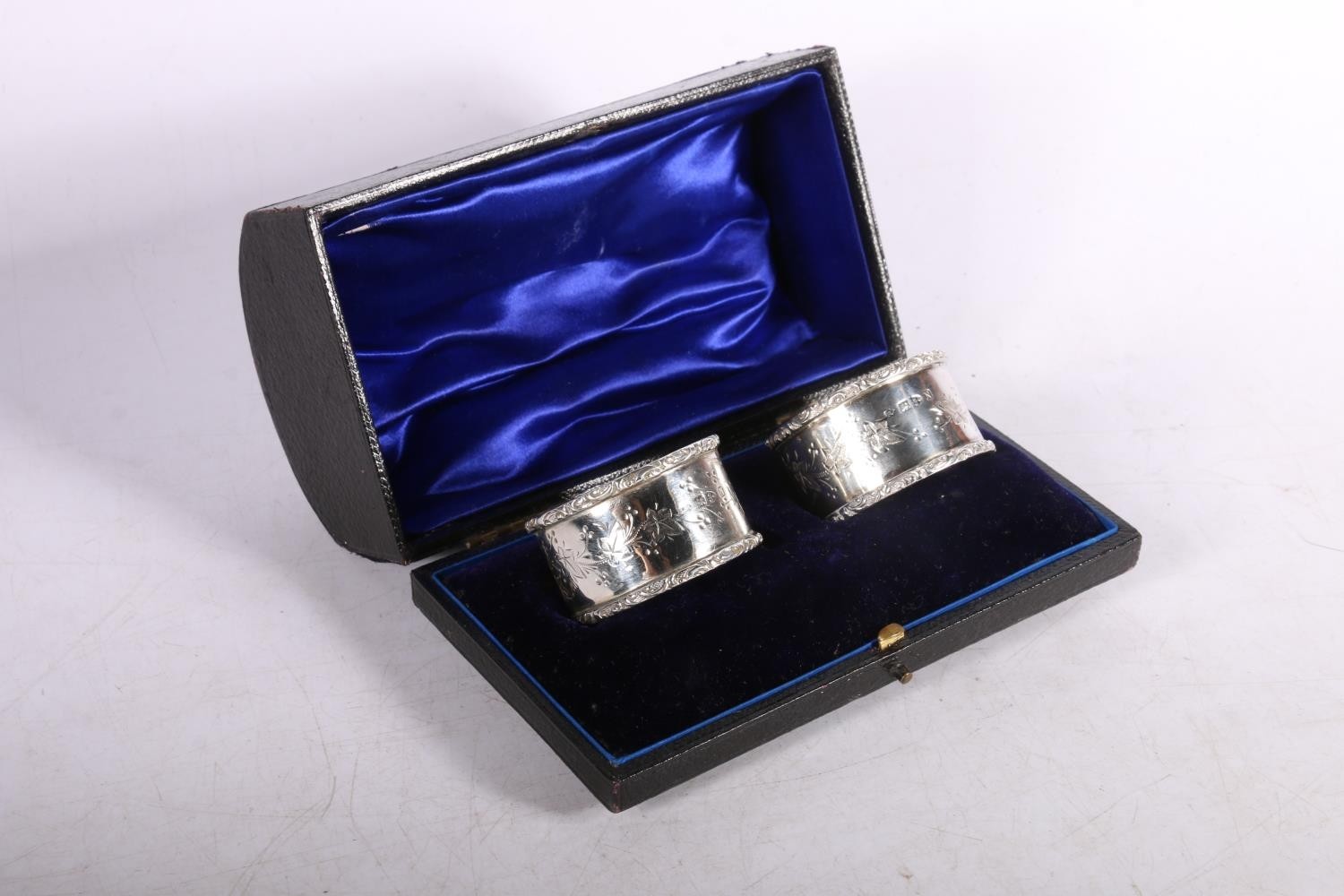 Victorian silver napkin rings with foliate decoration hallmarked Florence Warden, Chester 1896, in