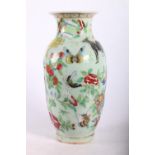 Late 19th early 20th c. Chinese baluster shaped vase with animals amongst flowers, 24cm.
